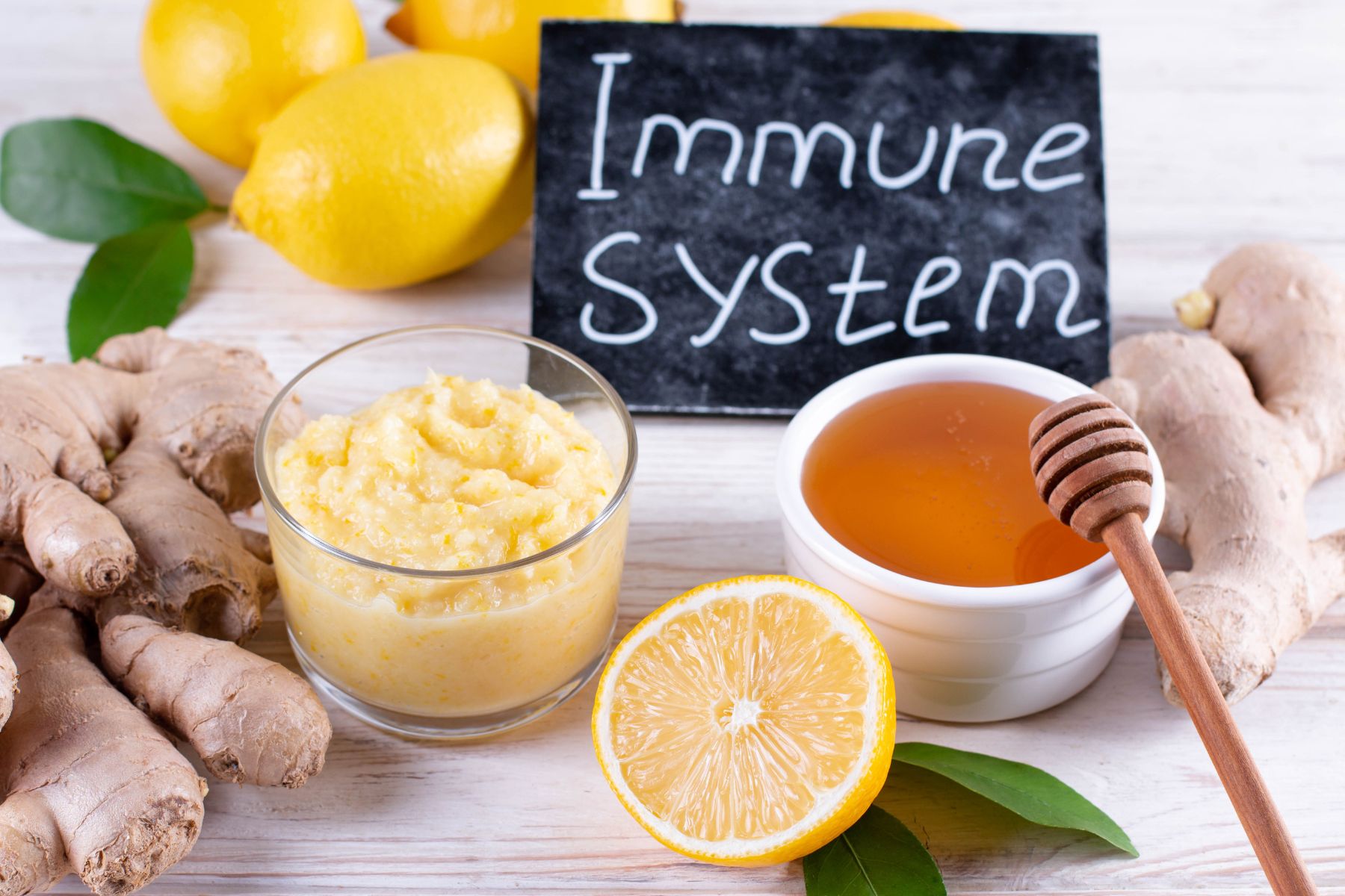 Immune system written in chalk surrounded to detox foods