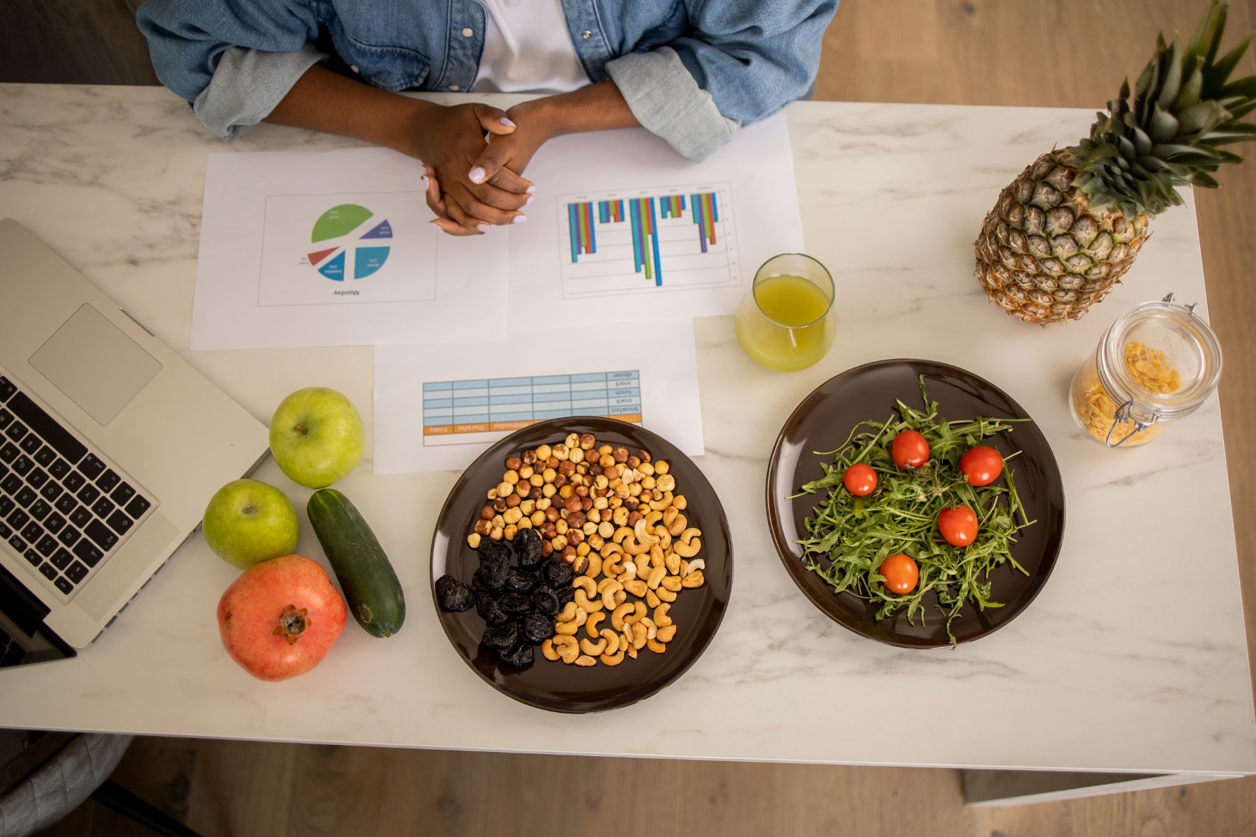 Dietitian sitting at work desk with nutrition assessment papers