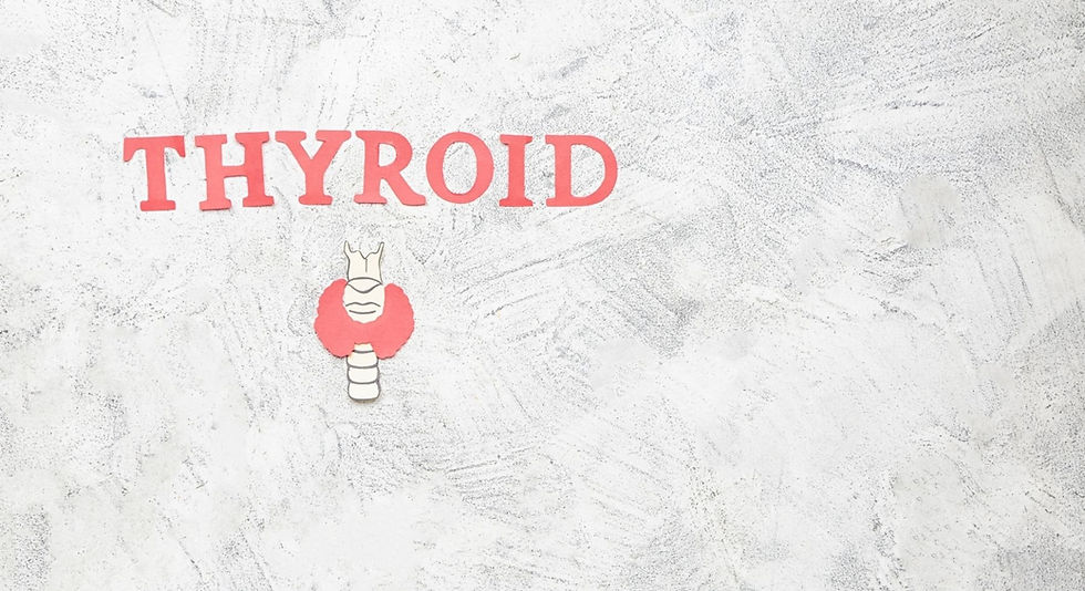 Thyroid spelt out in pink letters on a grey background and a pink cut out of a thyroid