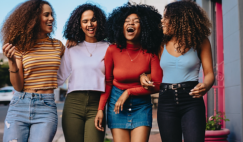 Teen girls walking and laughing.png