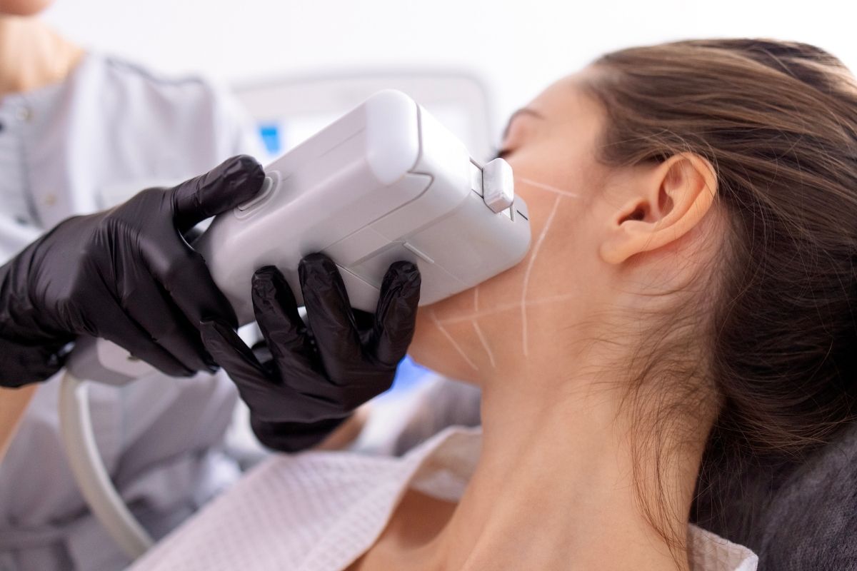 A client undergoing HIFU treatment for a firmer and more youthful jawline.