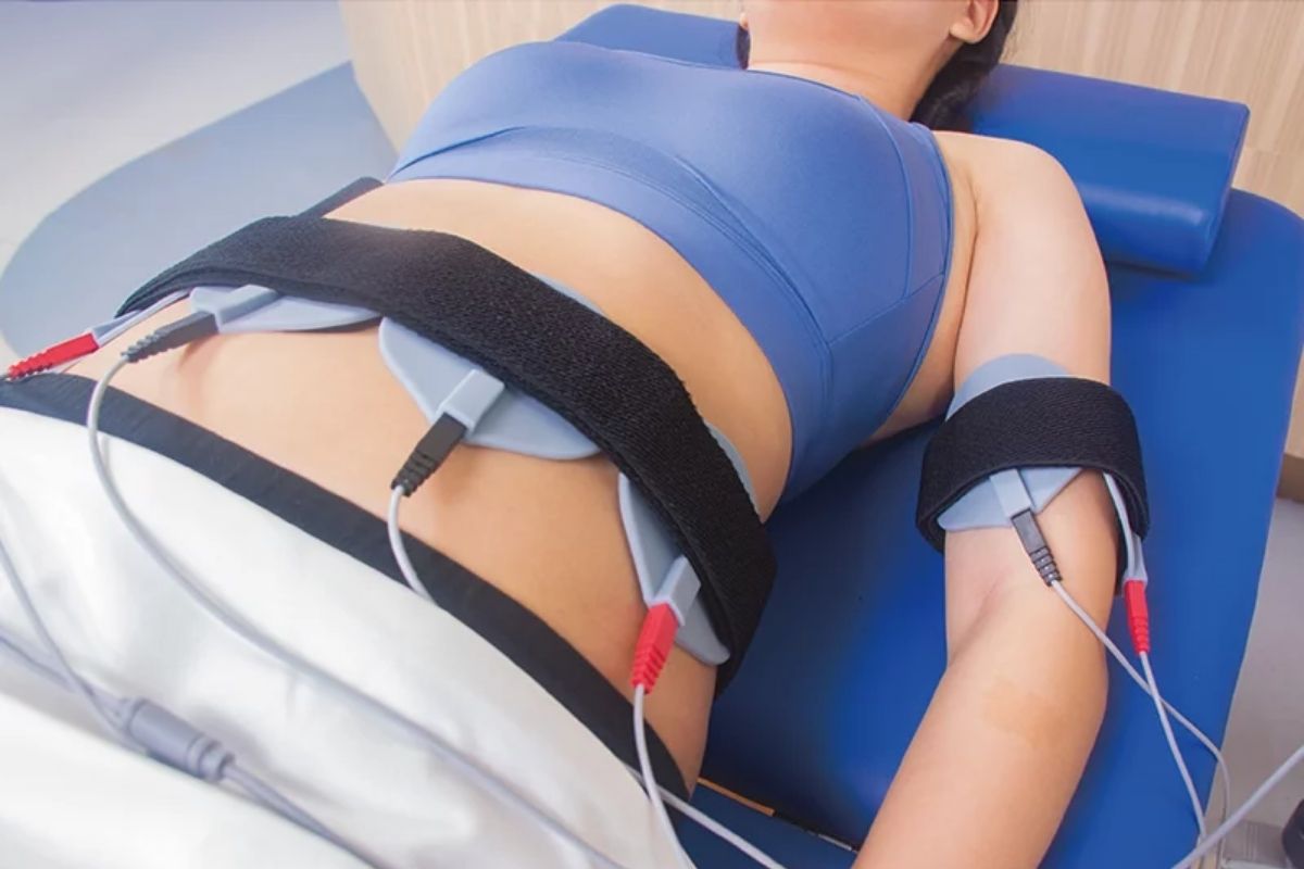 A client receiving EMS treatment for body fat reduction and muscle toning.
