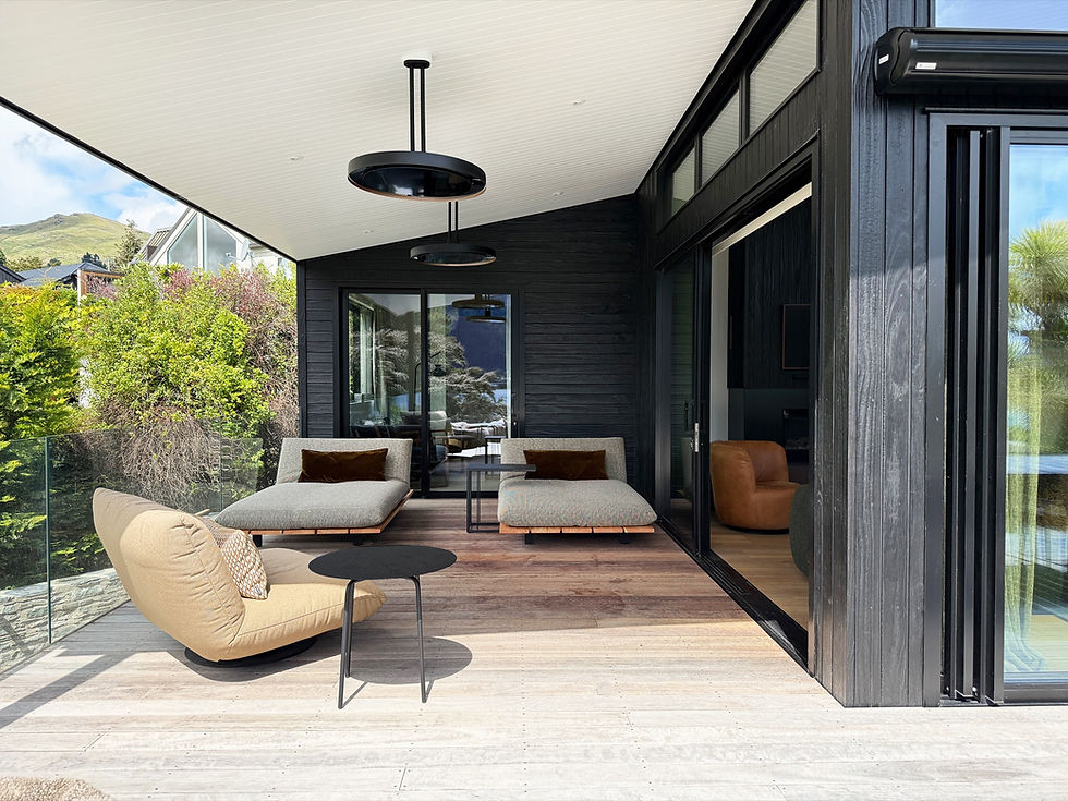 Bespoke modern patio with lounge chairs and black accents.