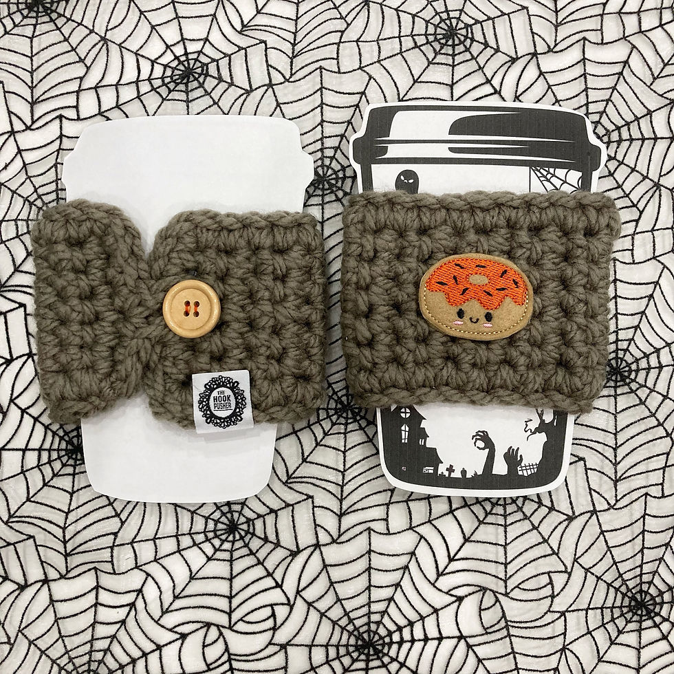 Thumbnail: taupe cup cozy with donut felt patch  - orange icing and black sprinkles