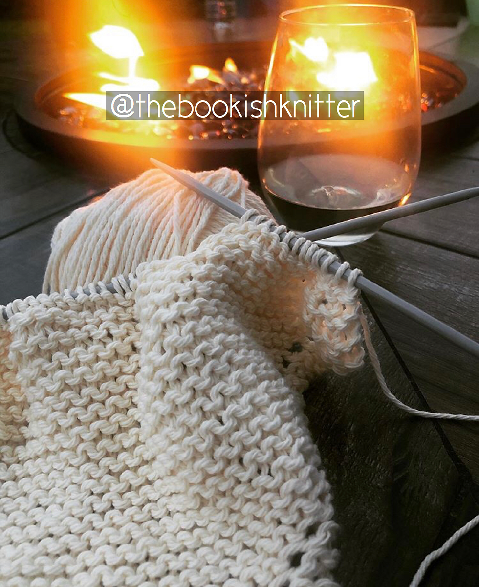 Thumbnail: lily sugar'n cream original yarn in the colour white, being shown in the process of knitting