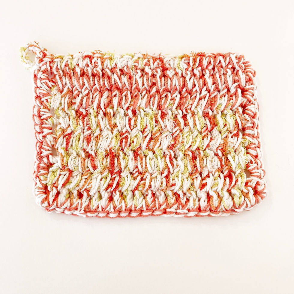 Thumbnail: a crocheted dishcloth made with lily sugar n' cream scrub off yarn in the colour papaya