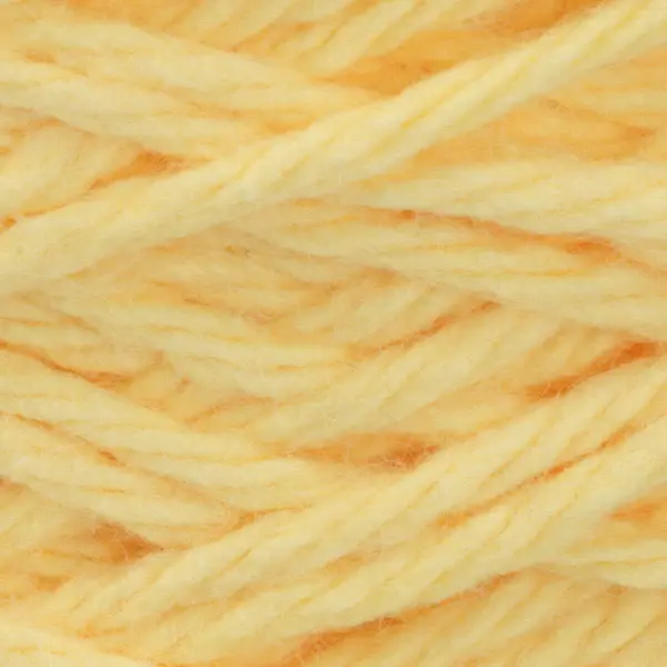 lily sugar n' cream cone yarn in the colour yellow, a nice bright butter yellow