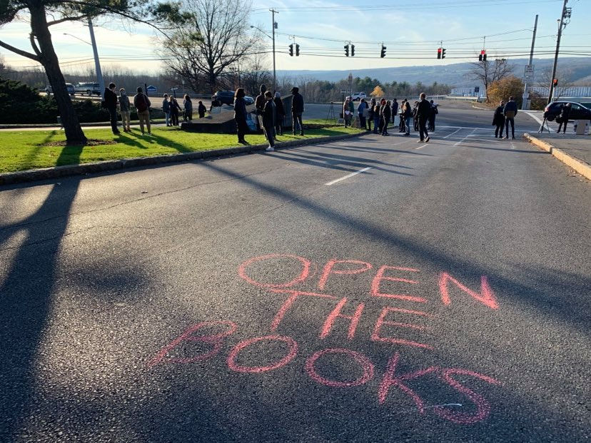 Protestors wrote messages in chalk for the administration, like "Solidarity not austerity," and "Rich admin=underpaid faculty." (Madison Fernandez/Ithaca Week)