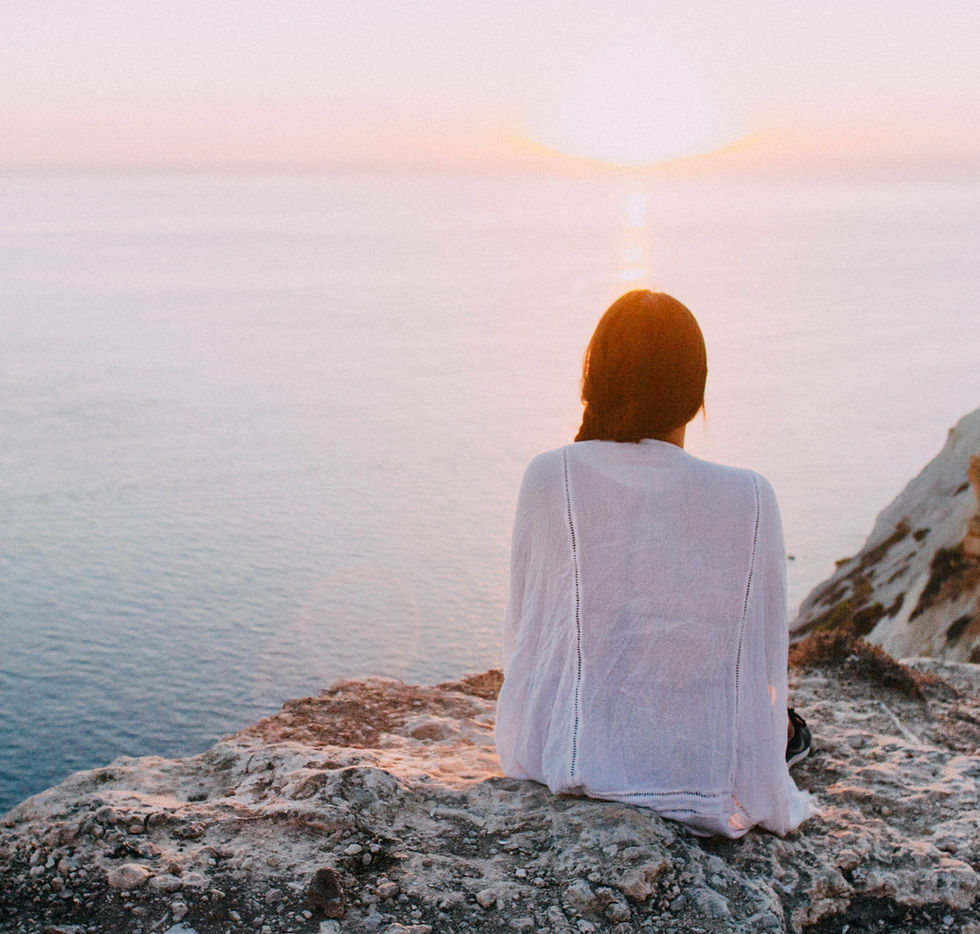Woman watching the sunrise during her morning routine