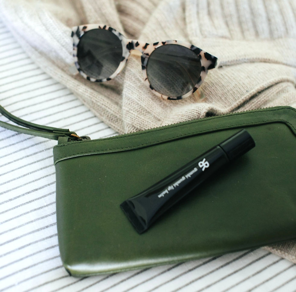 Purse and glasses reflecting someone's personal style