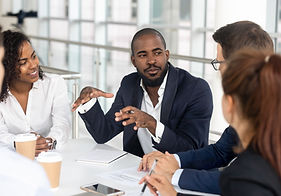 Millennial employees gathered in boardroom for training, black boss ceo leader leading cor