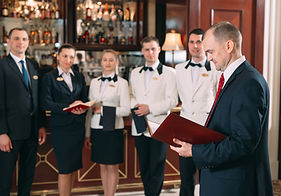 The interaction of the staff. Hotel or restaurant manager and his staff in kitchen. intera