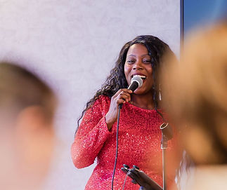 Ashya singing with a microphone