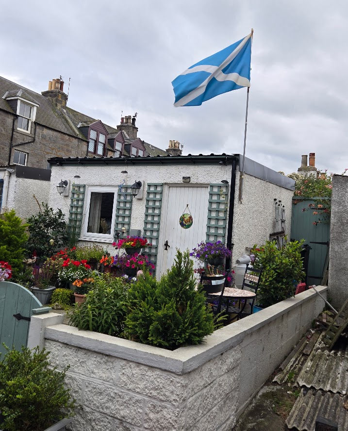 House in Fittie Flying Flag of Scotland