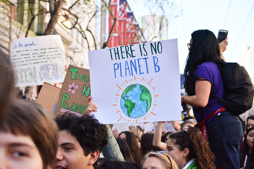 A climate change protest with the sign "there is no planet B"