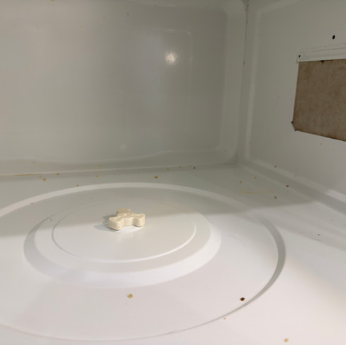 Dirty microwave interior before move-out cleaning in Vancouver.