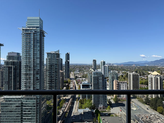 Freshly cleaned move-in ready condo balcony overlooking the Burnaby city skyline.