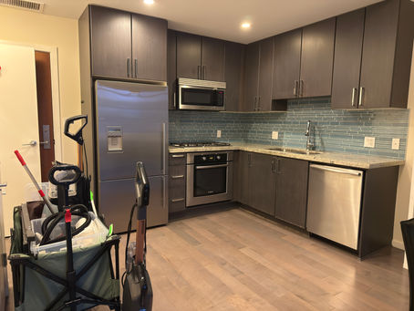 Finished Vancouver kitchen after professional move-out cleaning — polished stainless steel appliances, streak-free counters, and rental-ready presentation.