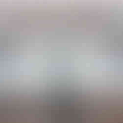 Fridge interior before Richmond move-out cleaning, with crumbs and debris left in the lower drawers.