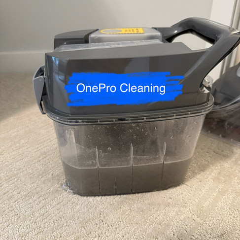 Dirty water collected after professional carpet cleaning in a one-year-old Coquitlam condo, showing hidden dust and dirt removed from the carpet.