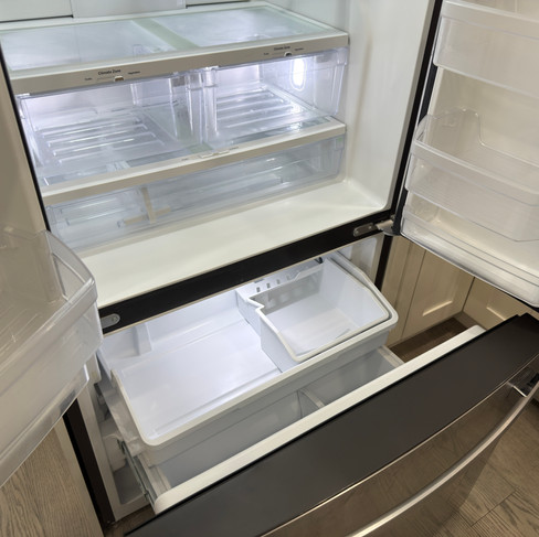 Fully cleaned refrigerator interior ready for the next residents.