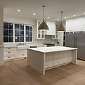 Spotless newly renovated white kitchen with island after post-renovation cleaning in Port Moody