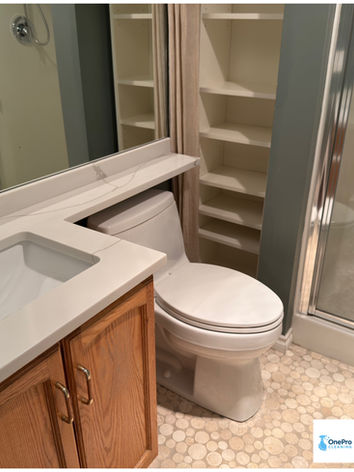 Spotless bathroom vanity, mirror, and toilet cleaned during a professional move out cleaning in Port Coquitlam.