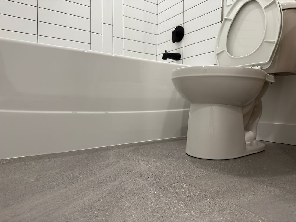 Bathroom floor and tub edge spotless after deep cleaning in Langley move-out service.