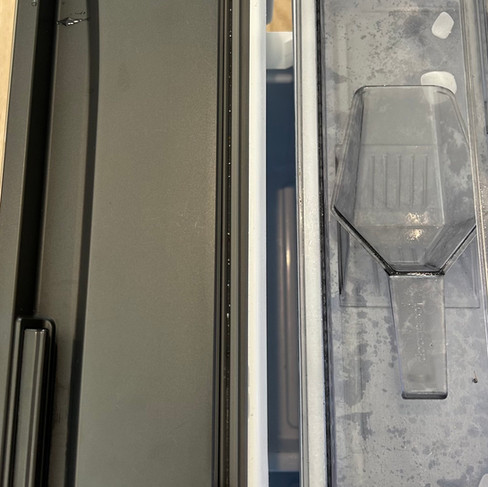 Fridge seal and edge with dirt buildup before move-out cleaning in Langley townhouse.