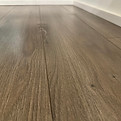 Close-up of professionally cleaned hardwood floor – whole-home move-out cleaning by OnePro Cleaning.