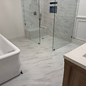 Pristine bathroom with glass shower and clean tiling from post-renovation cleaning in Port Moody
