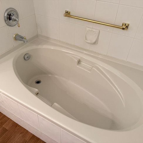 Hygienic white bathtub completely cleared of construction waste in Coquitlam.