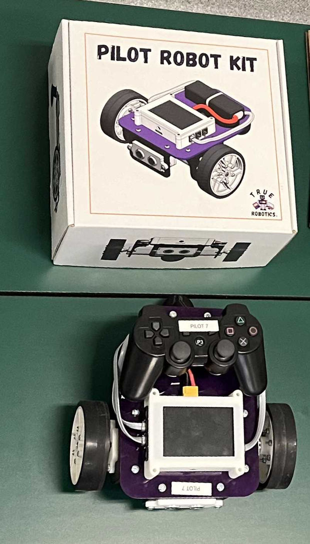 The image shows the PILOT ROBOT KIT packaging and the assembled robot next to a game controller, indicating the product's ready-to-use and controllable features.