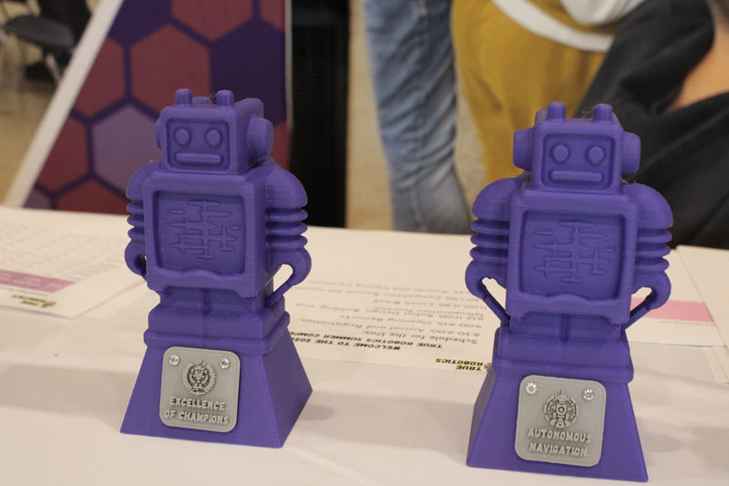 The purple robot trophies waiting for the winning teams.