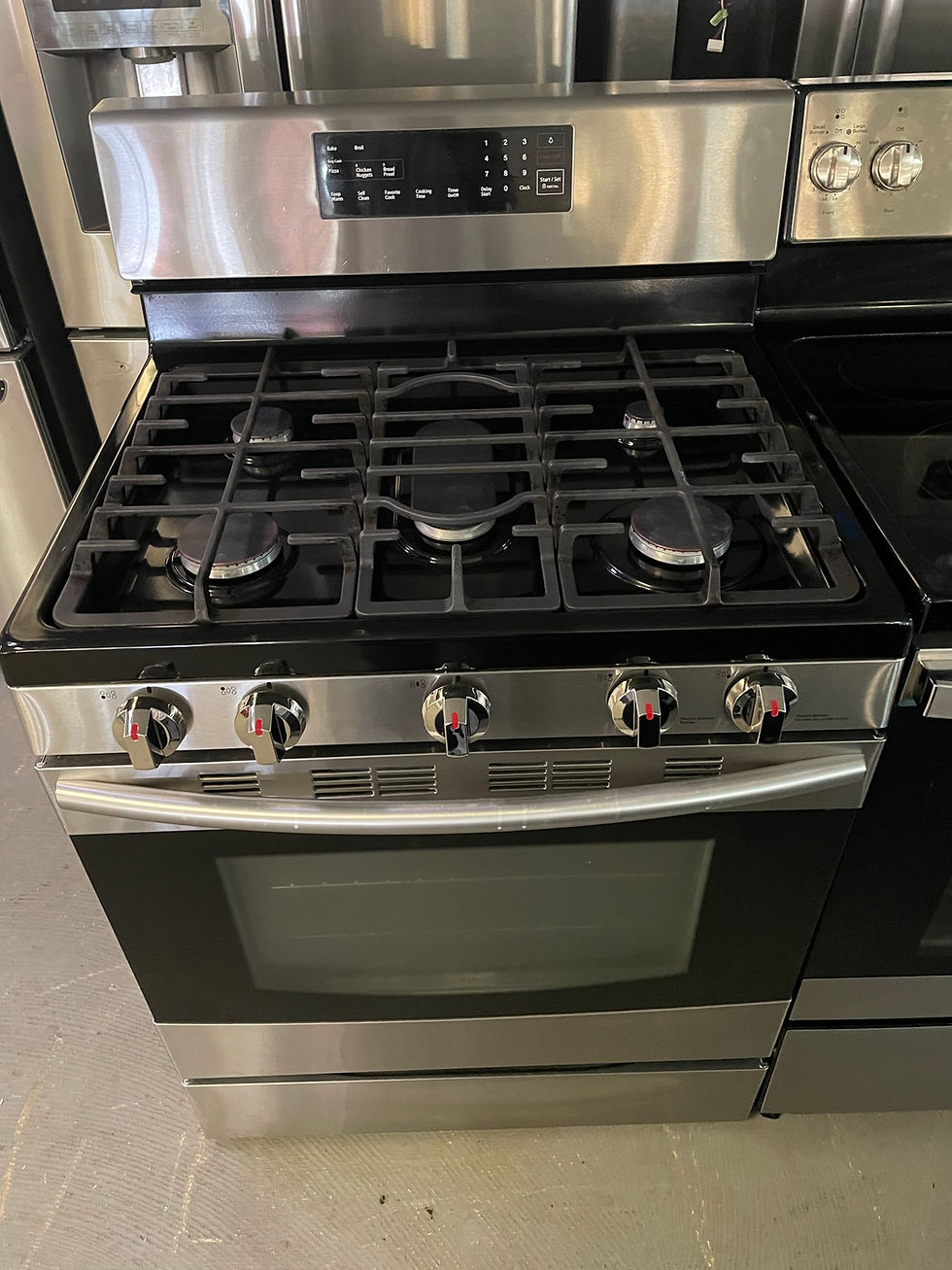 Samsung stainless steel 30” 5 burner Gas range. BETTER APPLIANCES
