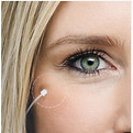 Close-up detail of professional headshot showing natural skin retouching and refined editing for corporate portraits.
