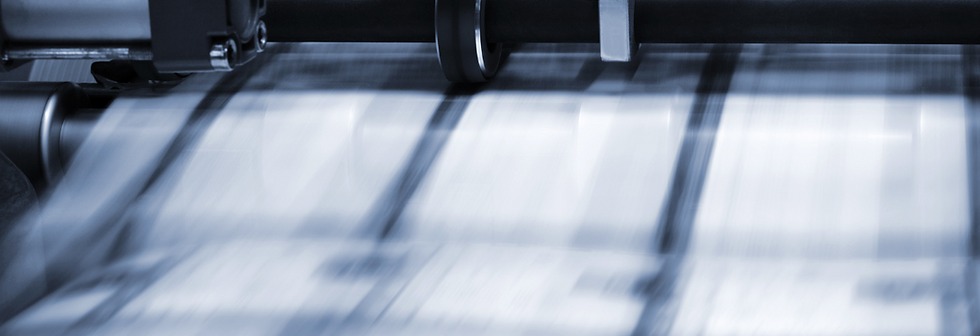 image showing a printer upclose as it prints on multiple pages that are stylistically blurred