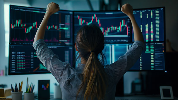 Supply & Demand Trading, Trader celebrating infront of charts.