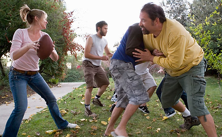 family playing football