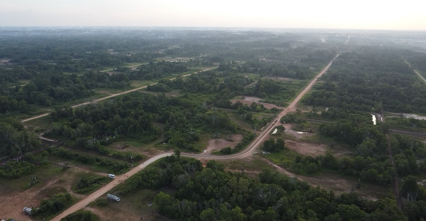 Drone view of the road layout for the improvement project at NK PHR by PT. Borneo Mitra Sinergi, illustrating construction and engineering strategies