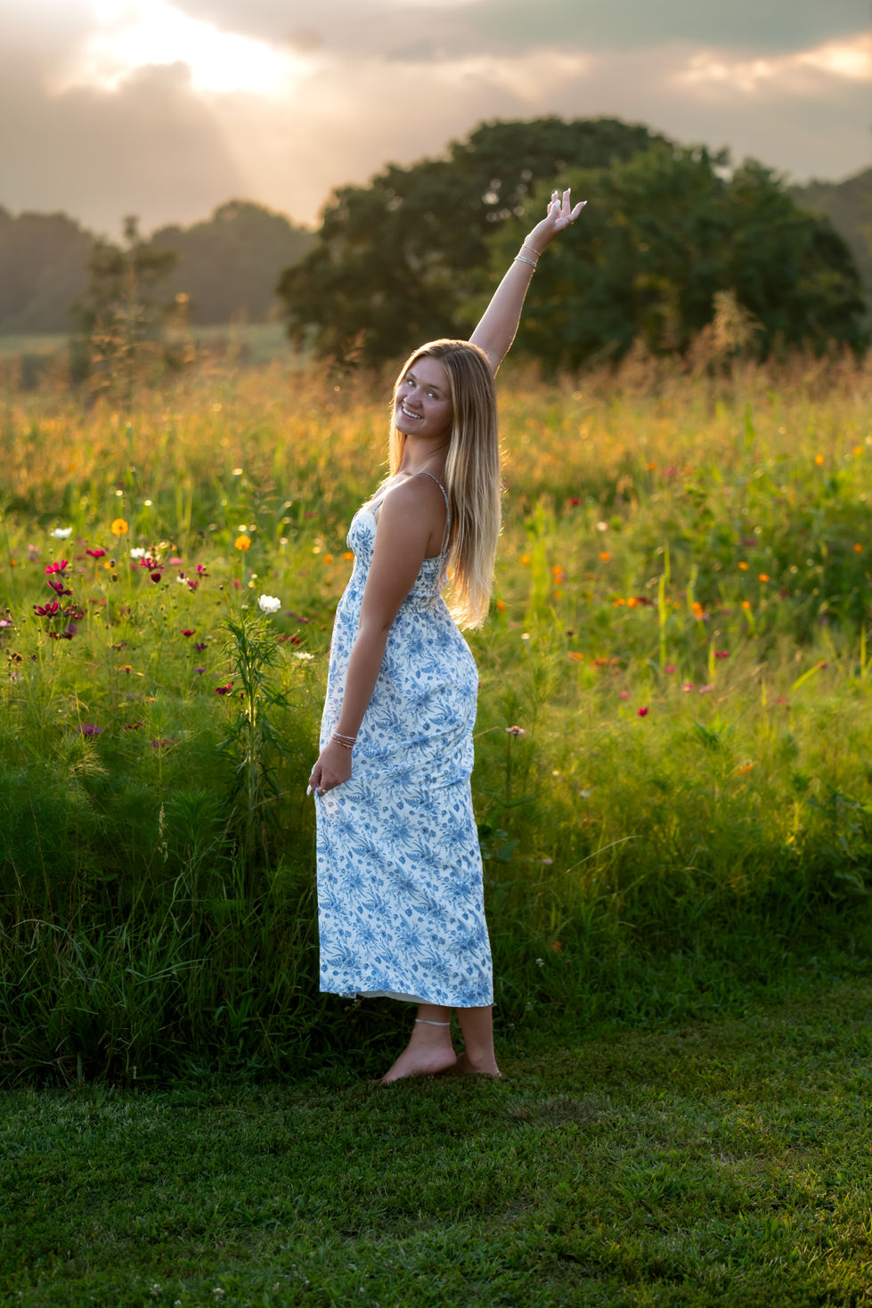 A senior photo session in a wildflower field.