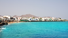 Coastal town and harbour in Lanzarote, Canary Islands, representing practical local support for people relocating
