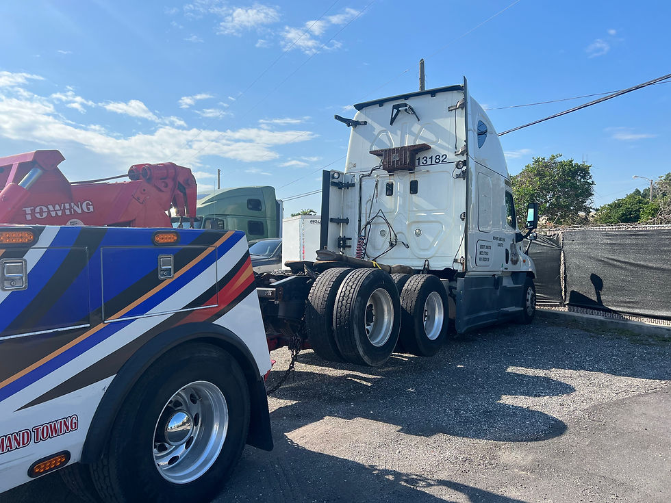 L.i Roadside Care & Towing heavy-duty tow truck assisting a semi-truck in Celebration, Florida
