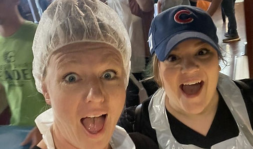 Pin-Up Curls team volunteering at a Fort Wayne community food drive.