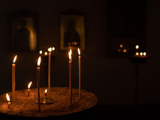 Candles lit in a dark room