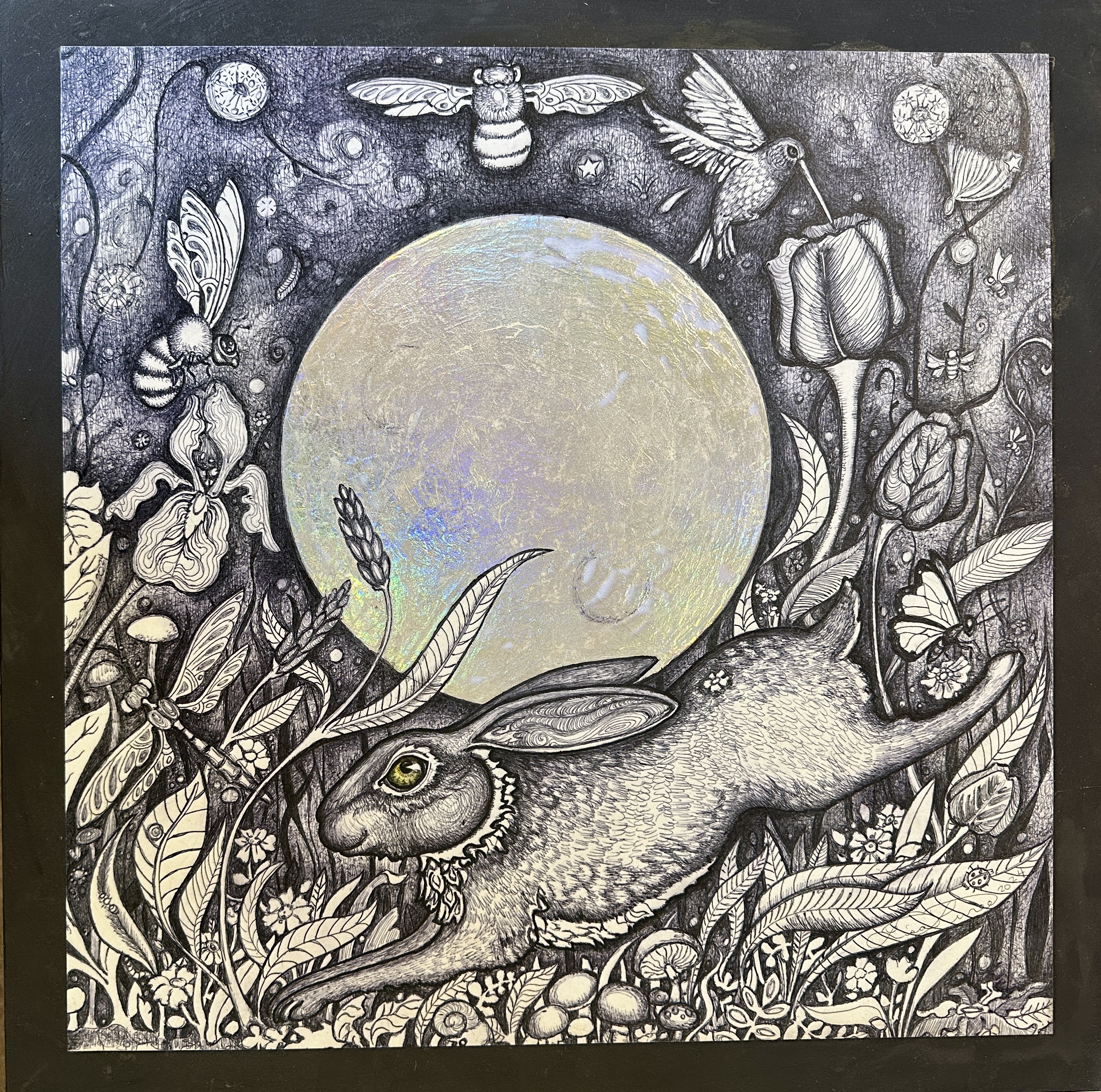 Bunny rabbit leaping beneath the moon