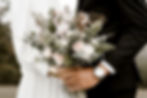 Wedding couple holding bouquet