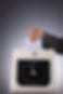 cropped-hand-inserting-card-clock-against-gray-background.jpg