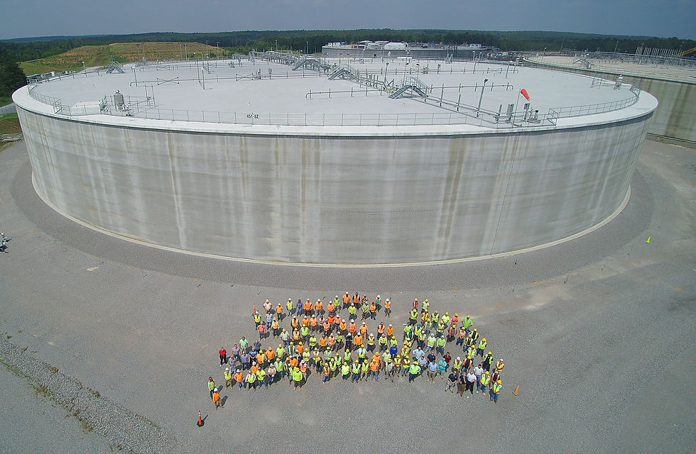 The U.S. Department of Energy-Savannah River and Savannah River Mission Completion team members gather in front of Saltstone Disposal Unit (SDU) 8, the third mega-size unit built at the Savannah River Site. The SDU 8/9 project team won the Project Management Achievement Award from DOE.