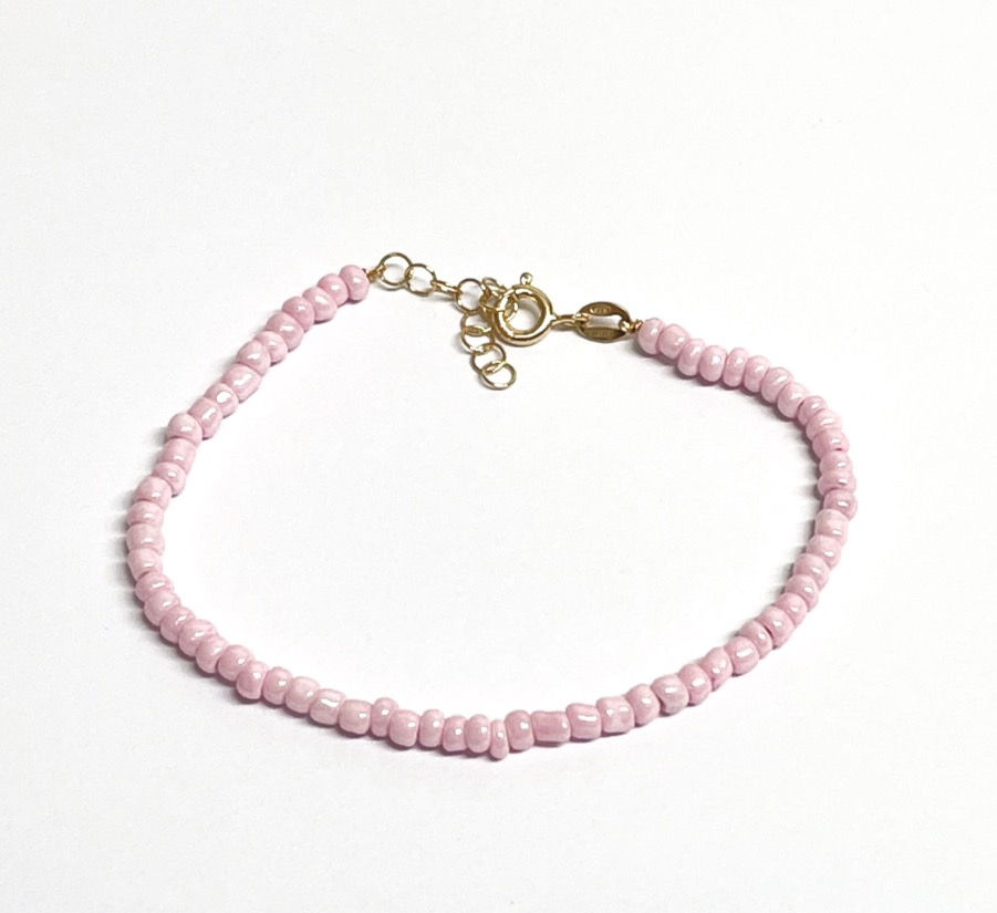 Thumbnail: Bracciali con perline sintetiche color